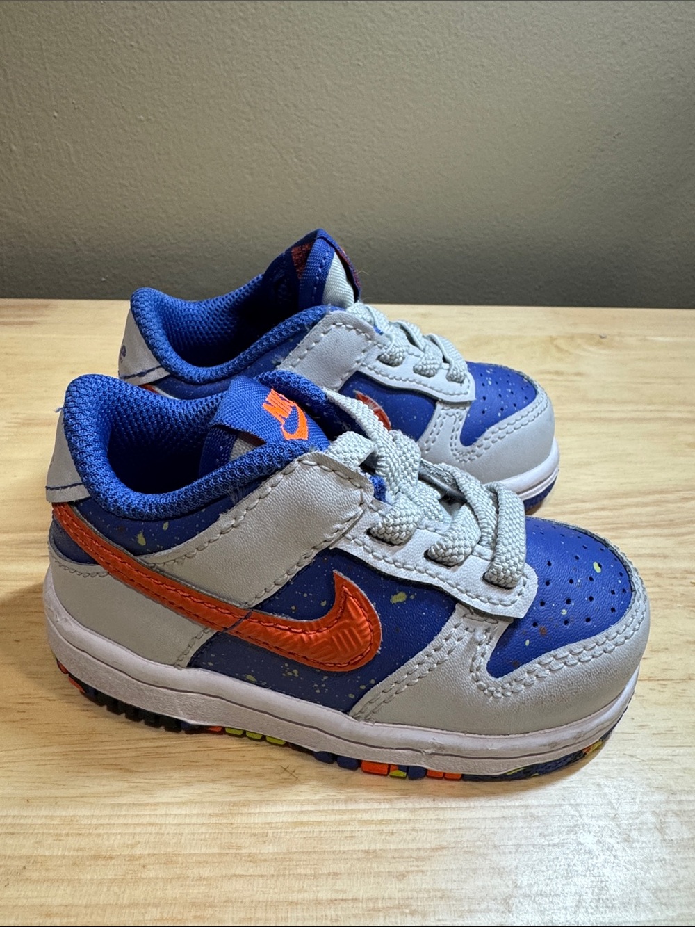 Nike Dunk Low GS Playground Pack Blue and Gray Sneakers with Orange Swoosh
